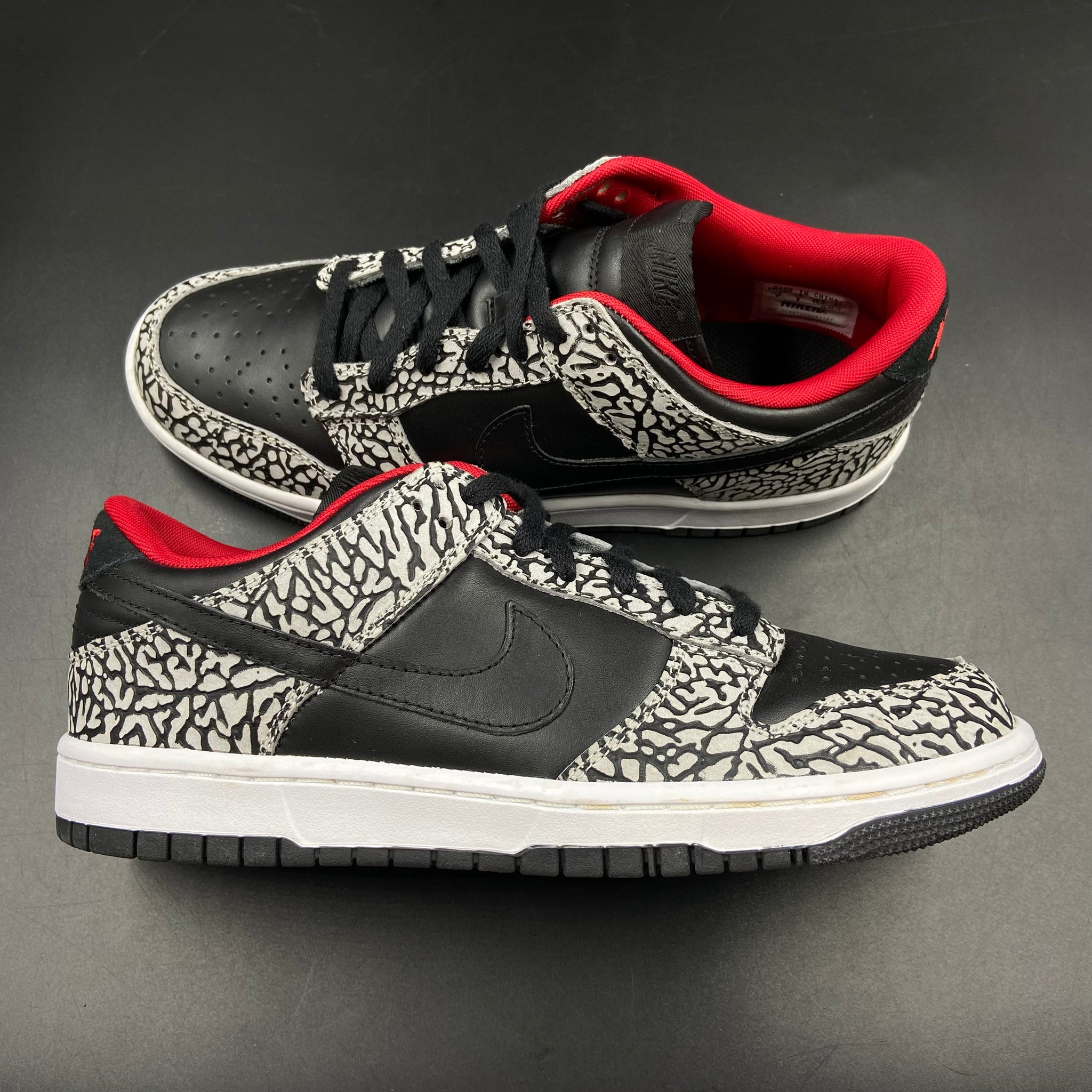 Nike sb dunk low supreme black cement sales